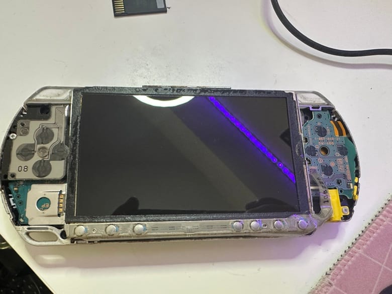 A disassembled overview of a PSP front